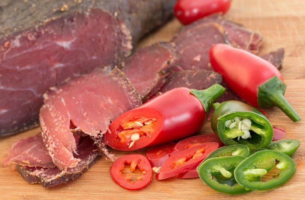 Free Image of dried beef meat processed smoked beef jalapeno healthy spicy tasty protein food sustenance summer cold meat flavor nourishment low carbohydrate diet green red nutrition diet snack slice dieting eating meal ingredient 