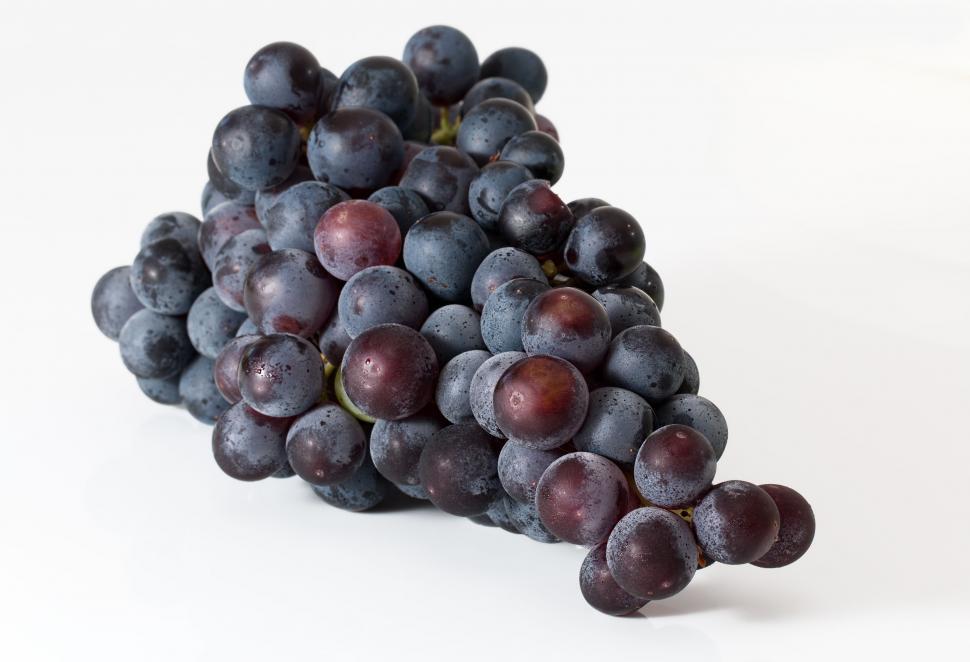 Free Image of Bunch of Grapes on White Surface 