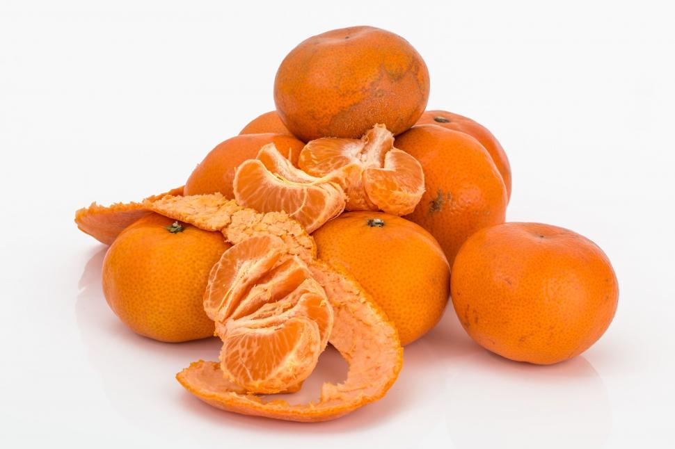 Free Image of A Pile of Oranges Stacked on Top of Each Other 