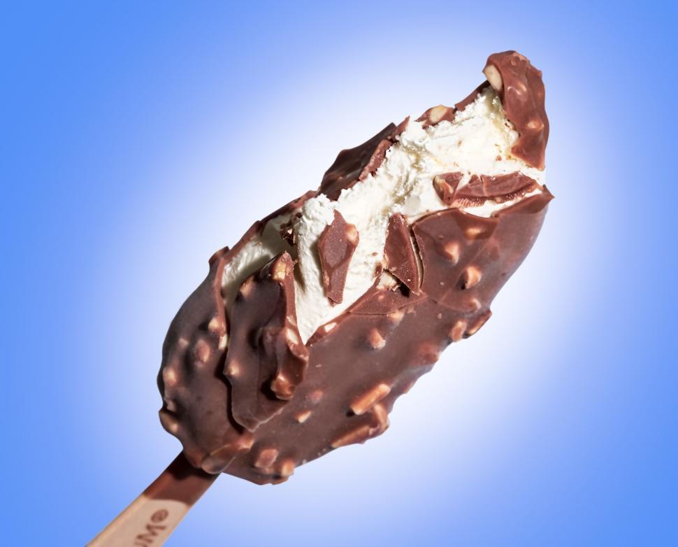 Free Image of Chocolate Covered Ice Cream on a Wooden Stick 