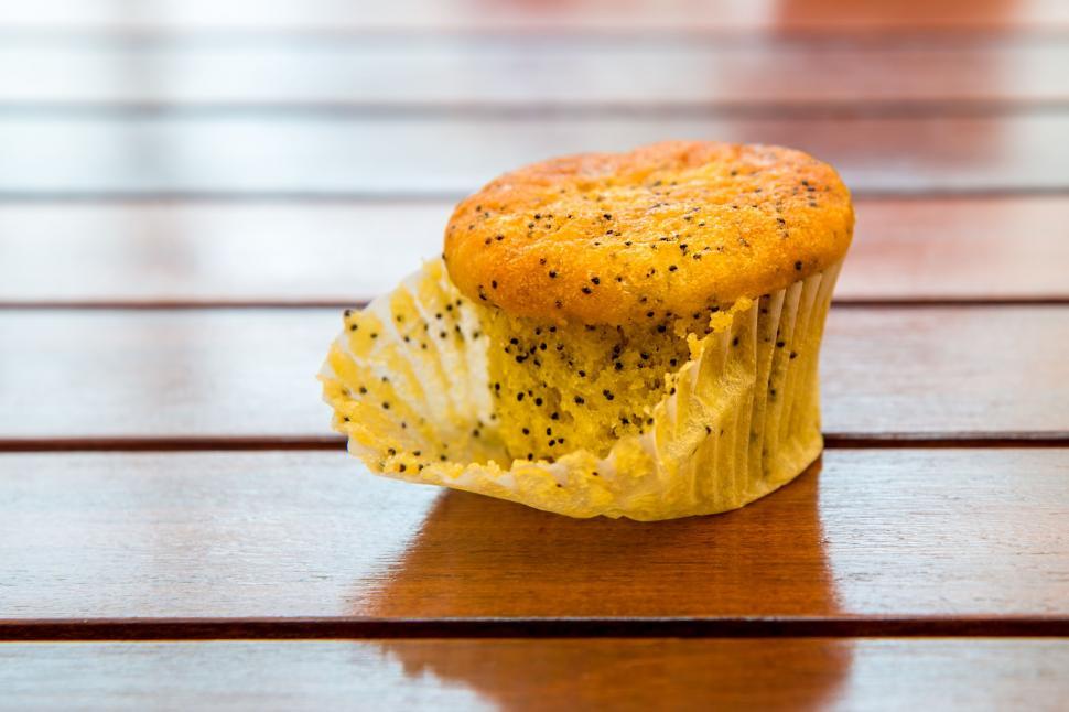 Free Image of Close Up of a Muffin on a Wooden Table 