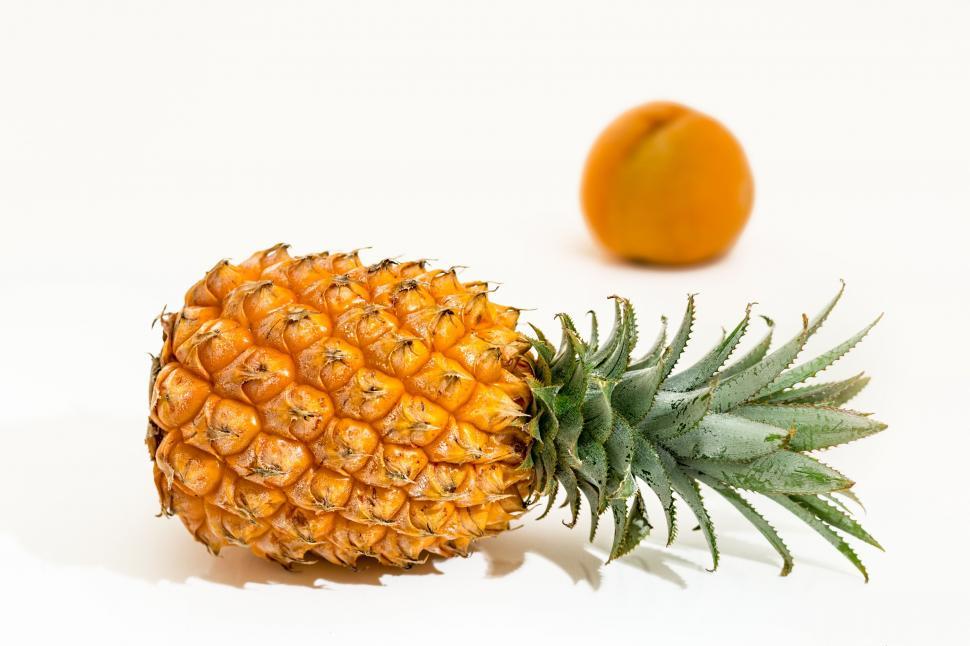 Free Image of Pineapple and Orange on White Background 