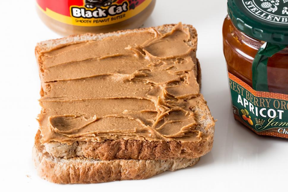 Free Image of peanut butter toast spread breakfast jam sandwich snack healthy nutrition protein bread diet nutritional jar vegetarian 