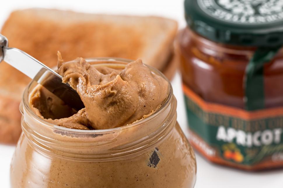 Free Image of Jar of Peanut Butter With Spoon 