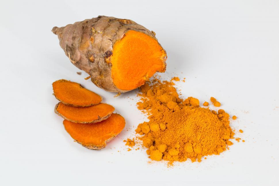 Free Image of Turmeric Root and Powder Displayed Together 