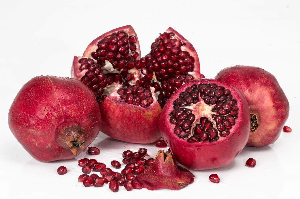 Free Image of A Bunch of Pomegranates on a White Background 