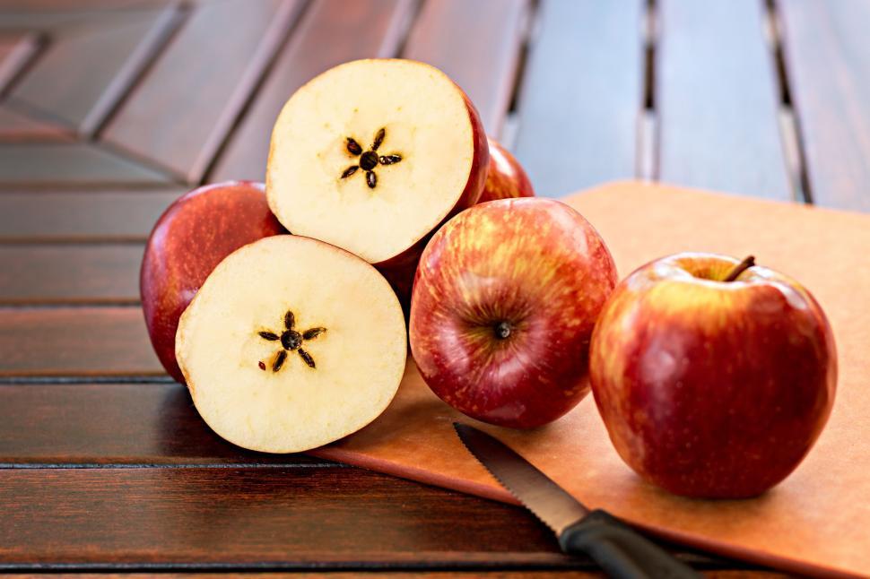 Free Image of Wooden Table With Sliced Apples on Cutting Board 