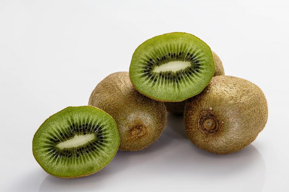Free Image of Group of Kiwis Sitting on Top of Each Other 