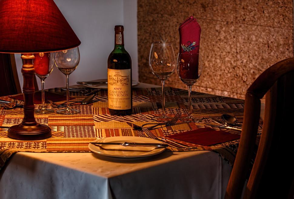 Free Image of Table With Wine Bottle and Lamp 