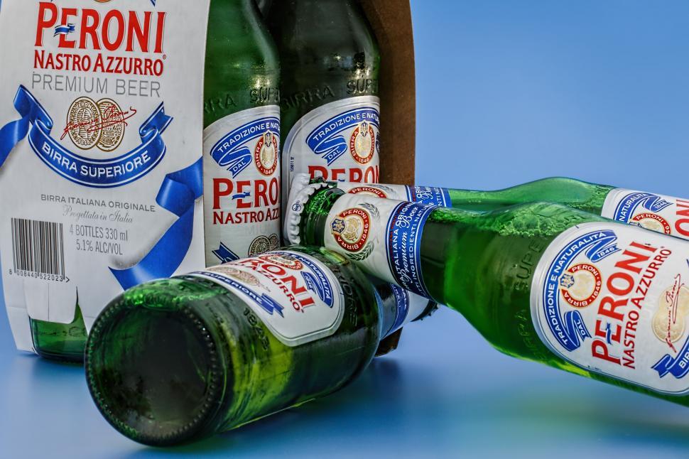 Free Image of Three Bottles of Beer Arranged Side by Side 
