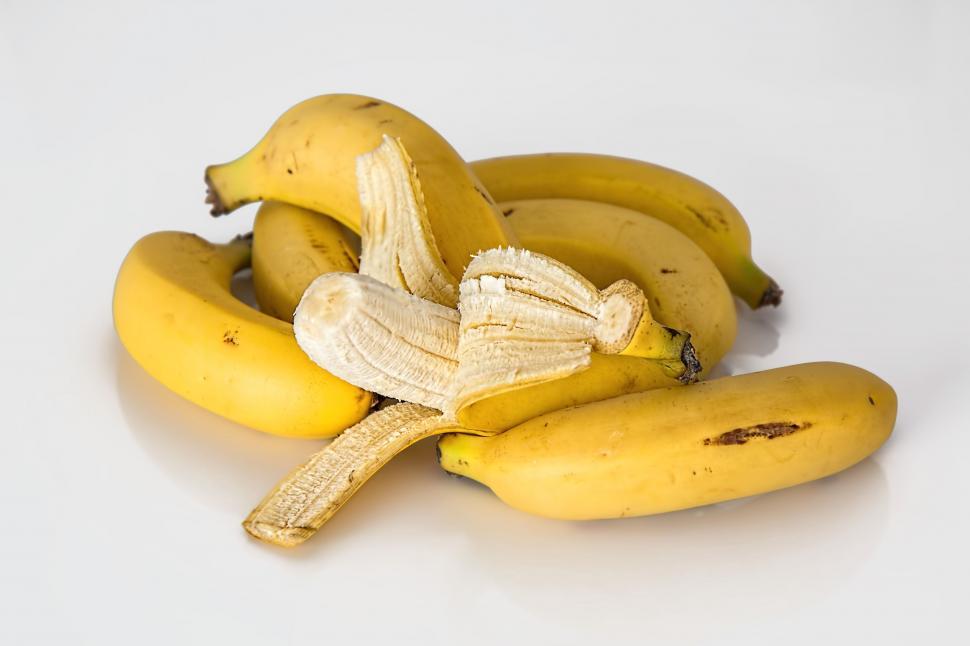 Free Image of Bunch of Ripe Bananas on White Table 