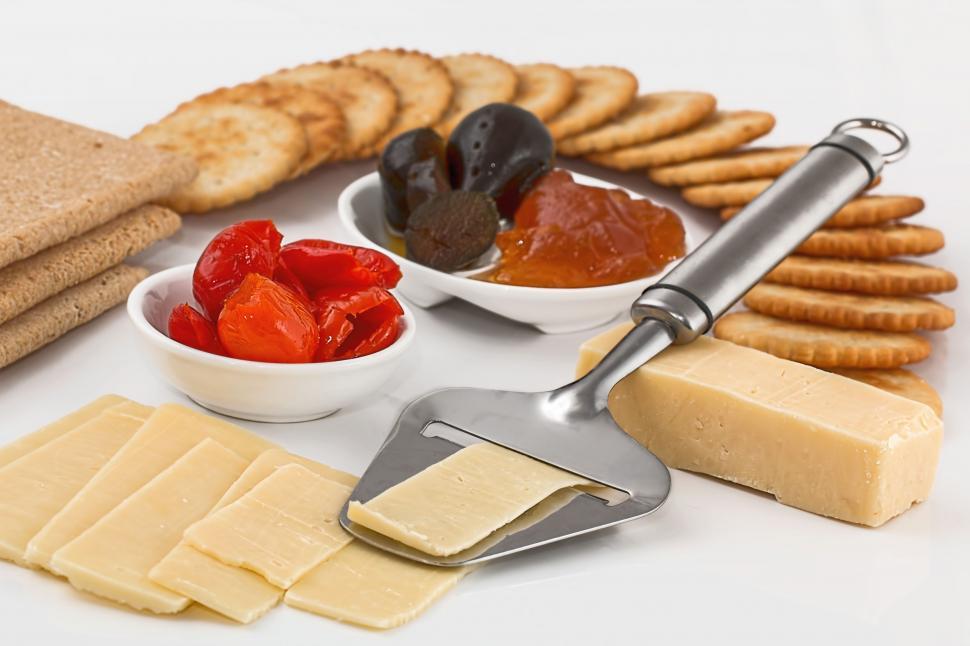 Free Image of cheese slicer crackers appetizers dairy product protein finger food snack hors d'oeuvre sliced cut diet food biscuits nutrition buffet platter nourishment 