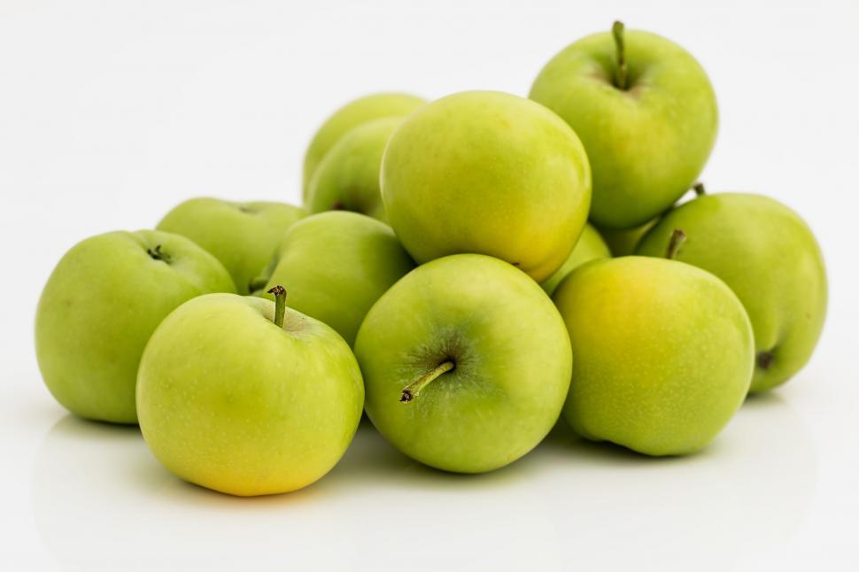 Free Image of A Stack of Green Apples 