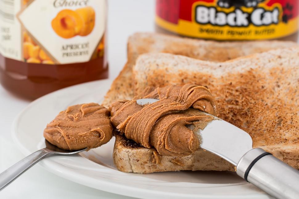 Free Image of Peanut Butter Spread on a Piece of Bread on a Plate 