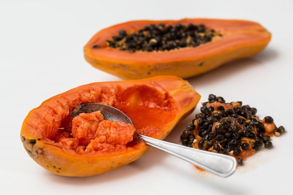 Free Image of Two Papaya Slices With Spoon 