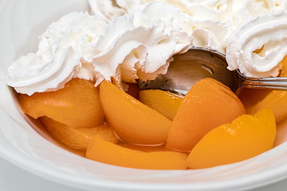 Free Image of apricot fruit whipped cream dessert sweet nutrition sugar delicious snack tasty canned fruit calories unhealthy eat treat temptation dieting food indulge diabetes 