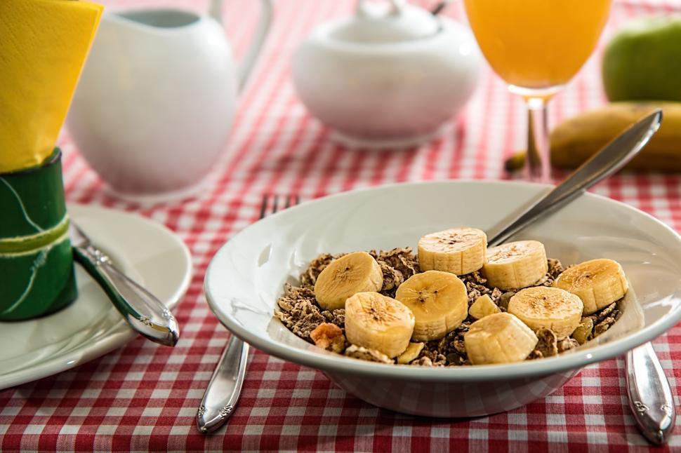 Free Image of cereal breakfast meal food bowl nutrition morning fruit banana diet eating table healthy lifestyle eat juice table setting milk jug sugar bowl tablecloth energy fiber flakes grain 