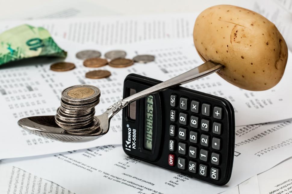 Free Image of Calculator, Potato, and Pile of Money 