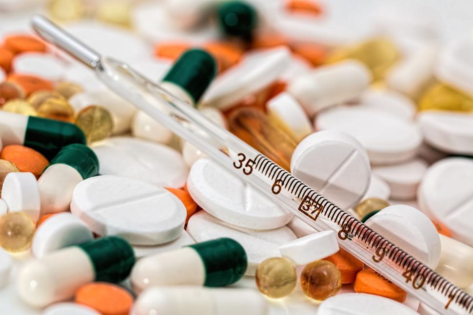 Free Image of Needle and Pills on Table 
