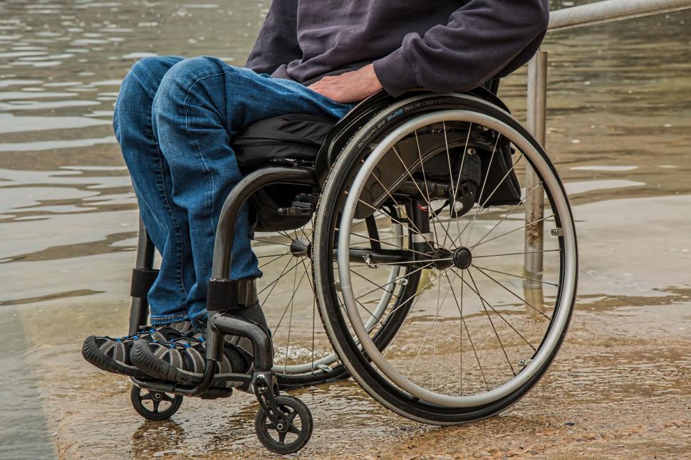 Free Image of Man in Wheelchair by Body of Water 