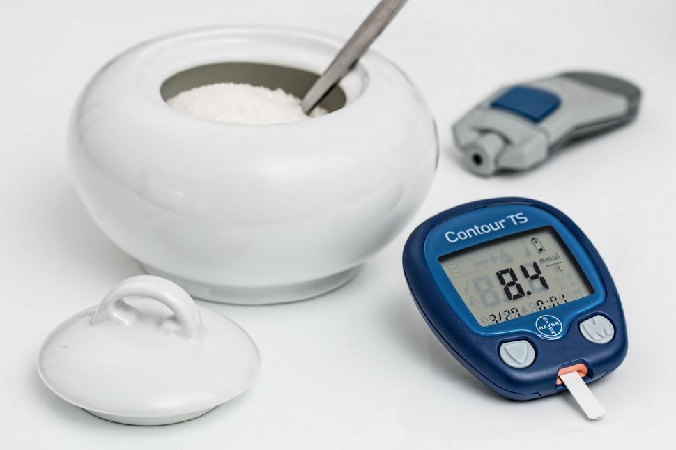 Free Image of Thermometer and Cup of Liquid on Table 