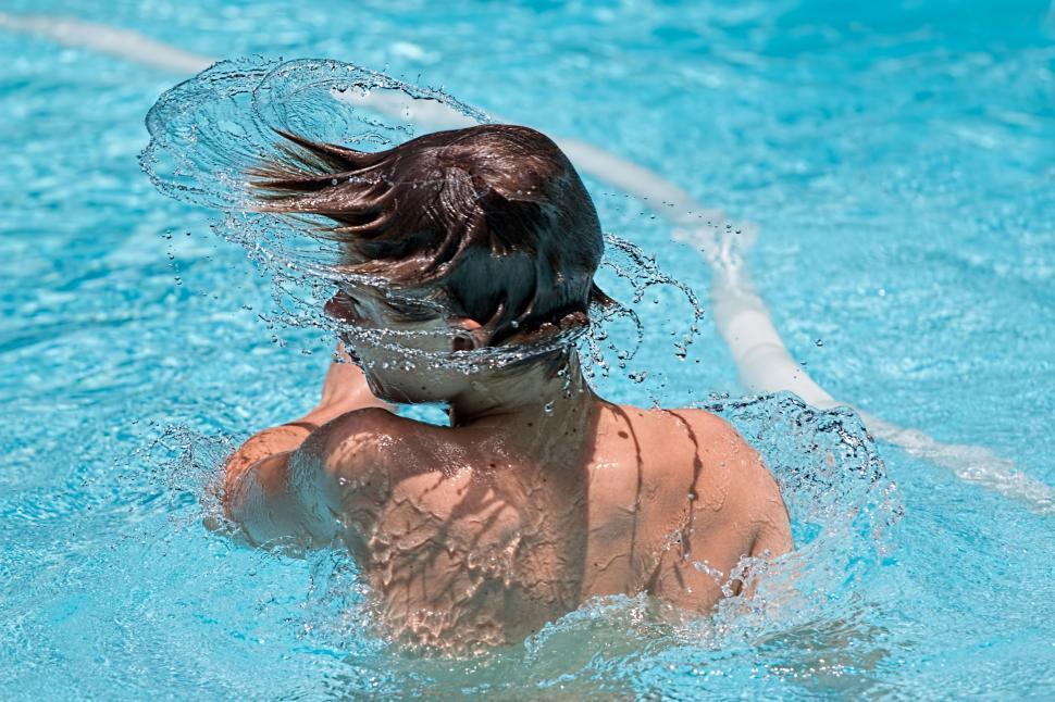 Free Image of Man Wearing Net on Head in Swimming Pool 