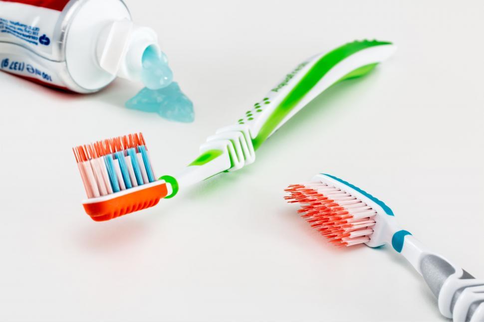 Free Image of Toothbrushes Next to Toothpaste Tube 