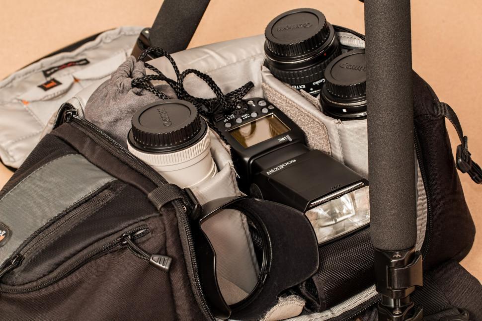 Free Image of Camera and Various Items in Backpack 