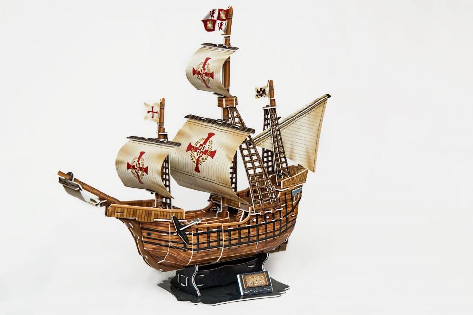 Free Image of Wooden Model of a Pirate Ship on White Background 