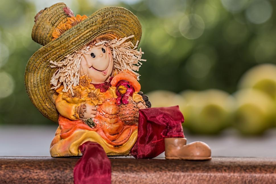 Free Image of Small Scarecrow Figurine on Table 