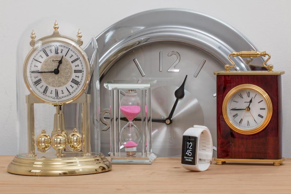 Free Image of Clocks on Wooden Table 
