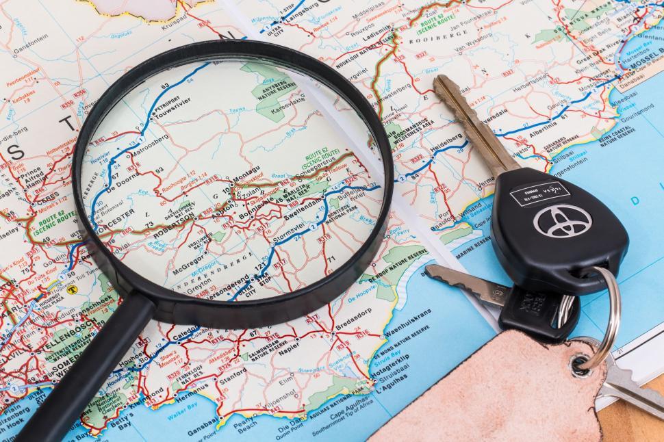Free Image of map vacation travel driving holiday car keys magnifying glass trip summer journey tourism adventure leisure tourist road drive transport route way street plan destination distance information location navigation direction highway gps cartography traffic navigator 