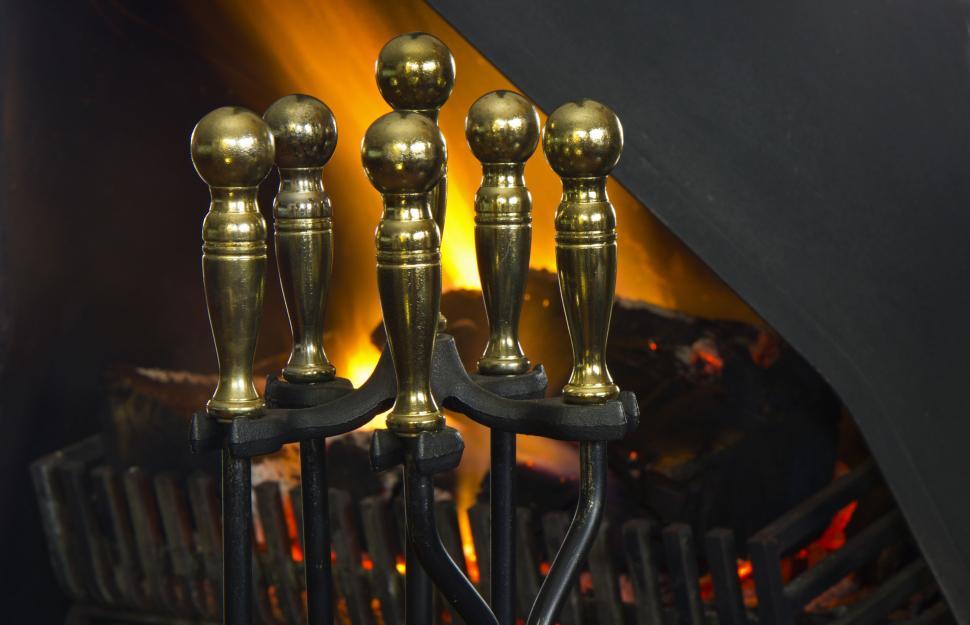 Free Image of Group of Golden Candles Next to Fireplace 