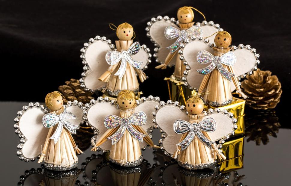 Free Image of Group of Angel Ornaments on Table 