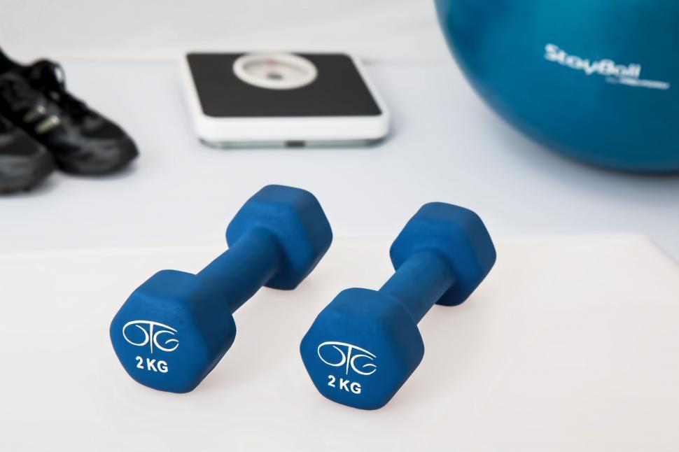 Free Image of Blue Dumbbells Resting on a Table 