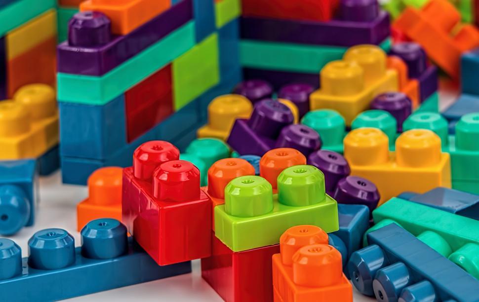 Free Image of building blocks construction play toy colorful game education preschool learning plastic development components develop brick fun activity structure childhood learn heap elements pile create 