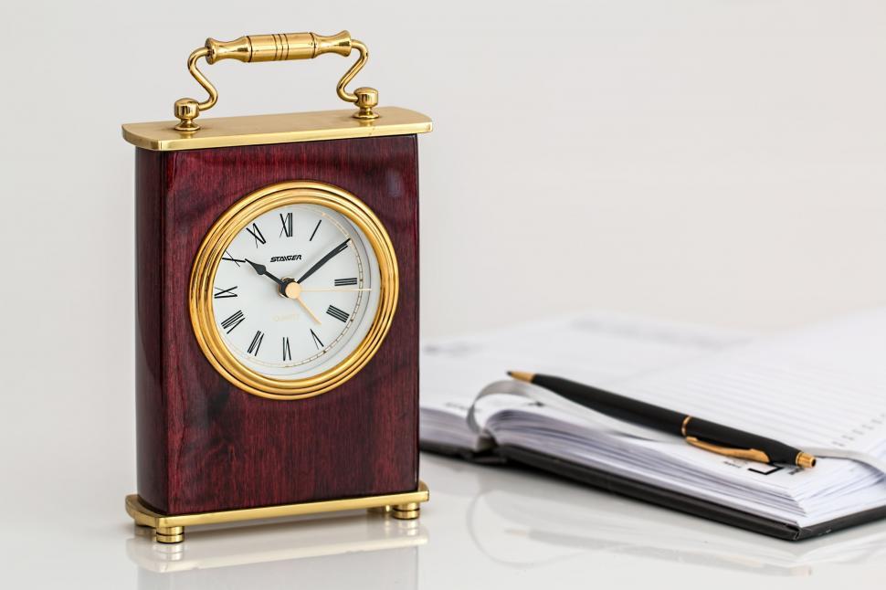 Free Image of Small Wooden Clock on Table 