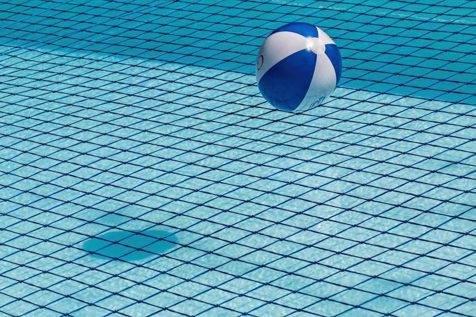 Free Image of swimming pool safety net beach ball blue water clean swim pool safety water quality relaxation swimming summer activity leisure healthy wet recreational outdoors transparent poolside sunny pattern hot weather heat tropical weather sunshine season climate sunlight water filter refreshing heat wave global warming chlorine crystal clear 