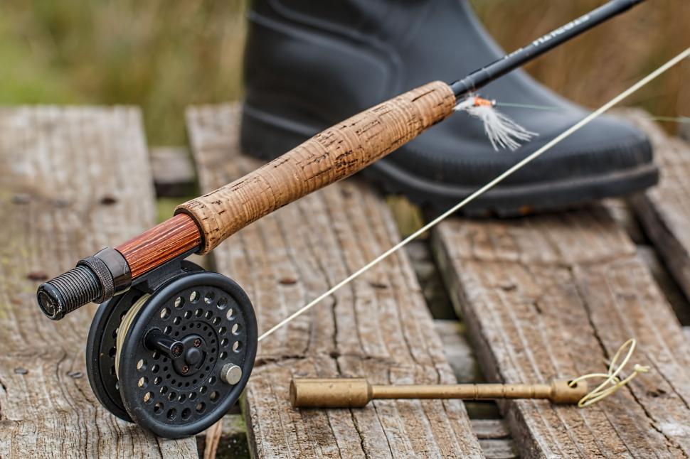 Free Image of Fishing Rod and Fly Rod on Wooden Table 