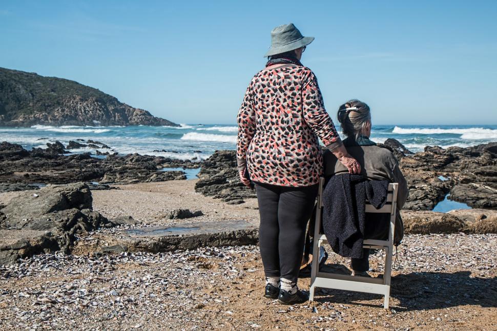 Free Image of women friends friendship helping together mature bond senior female care help support love assistance togetherness old friends conversation old people chatting talking reminiscing remembering sharing ideas getting old memories elderly nostalgia seaside rocks herolds bay 
