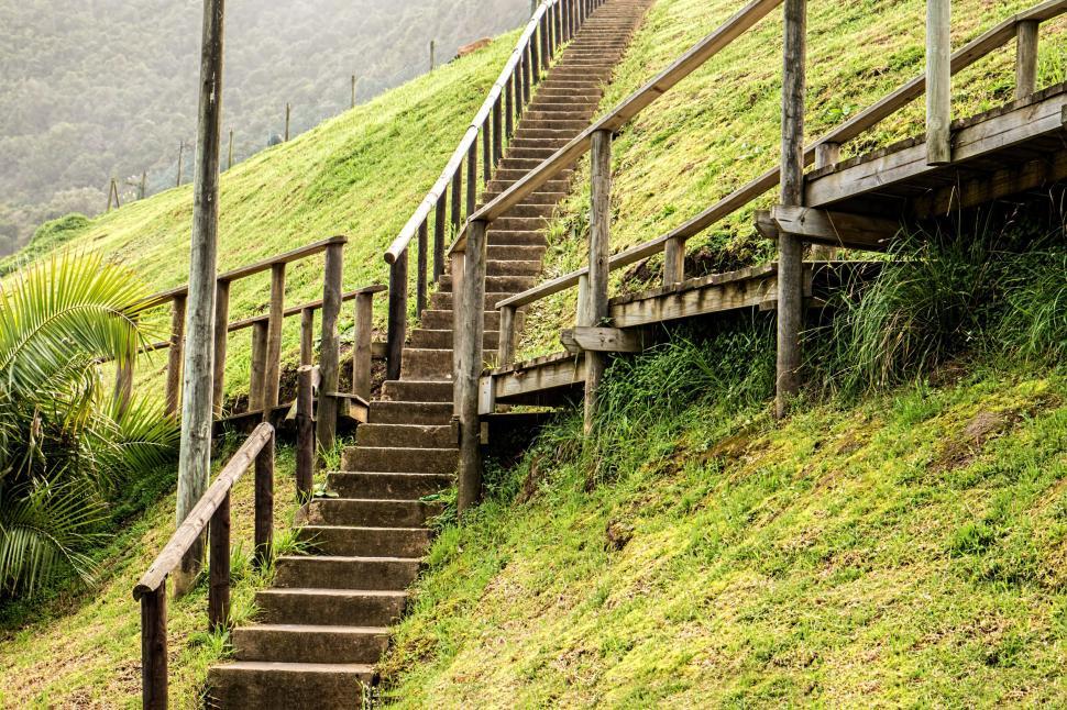 Free Image of Stairs Ascending Grass-Covered Hill 