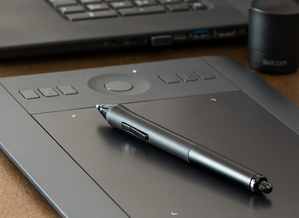 Free Image of Pen on Top of Laptop Computer 