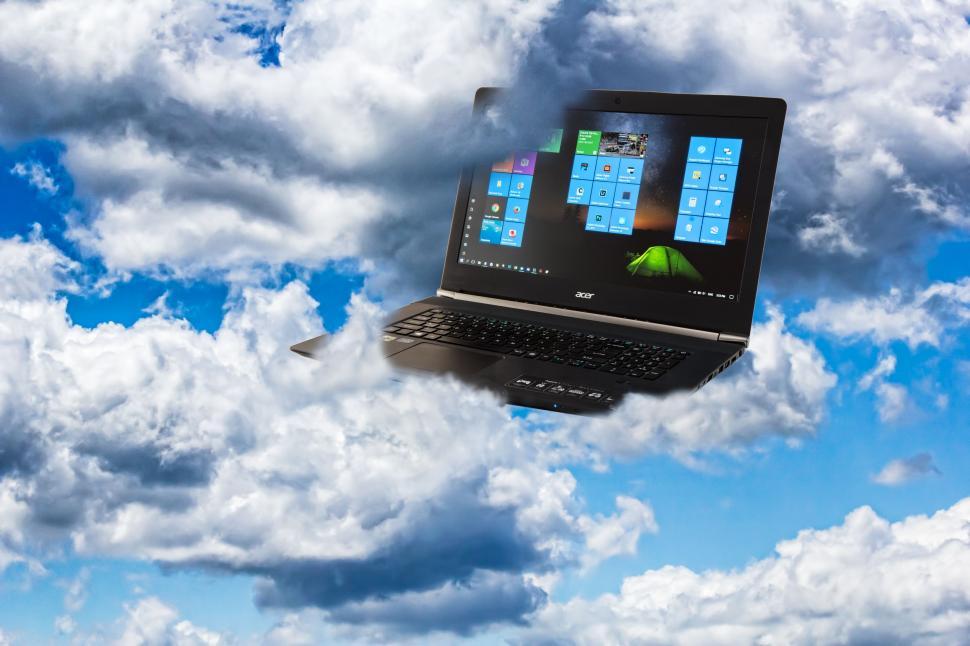 Free Image of Laptop Flying Through the Clouds 