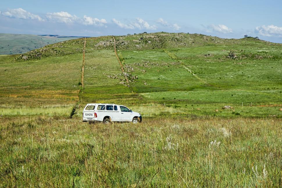 Free Image of White Truck Parked in Grass Field 
