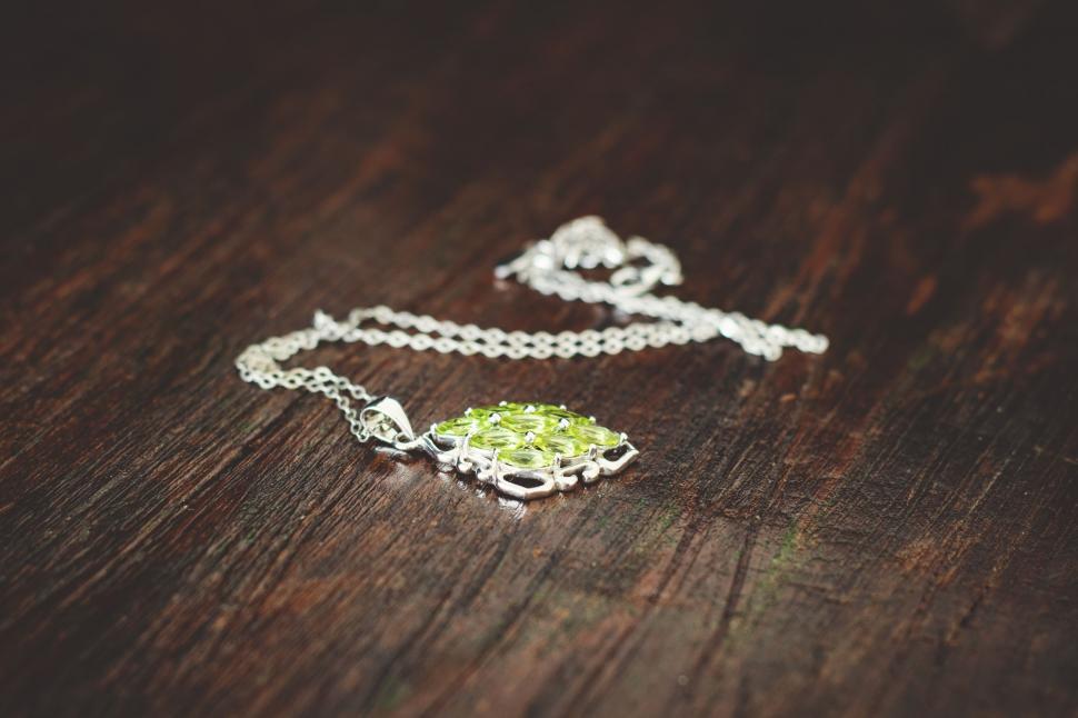 Free Image of Dazzling Necklace Resting on Table 