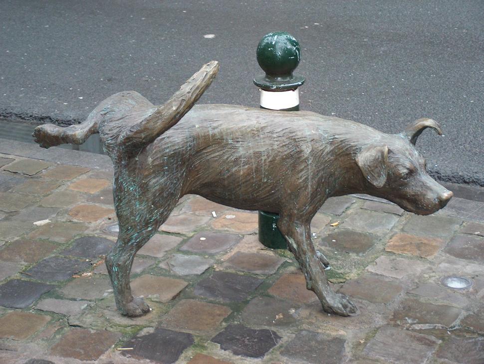 Free Image of Statue of a Dog on a Sidewalk 