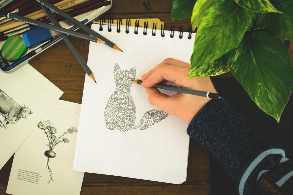 Free Image of Overhead view of Sitting Cat Sketch/Drawing with houseplant leaves  