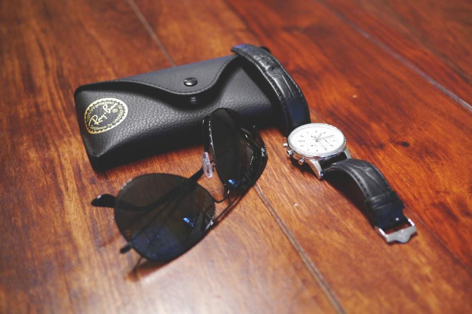 Free Image of Sunglasses and wrist watch  