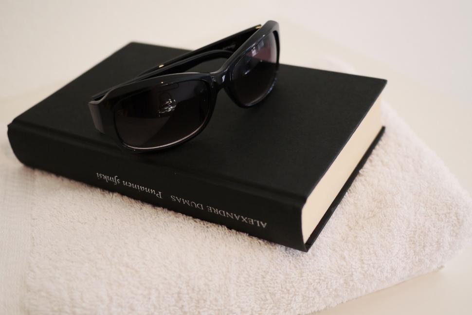 Free Image of Towel, Sunglasses and Book  