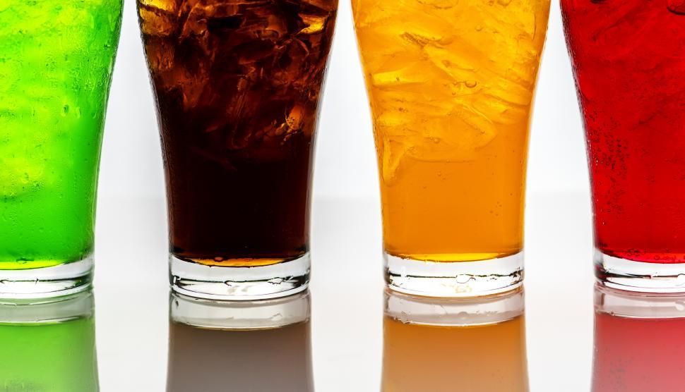 Free Image of Feet of colorful soft drinks in pint glasses 